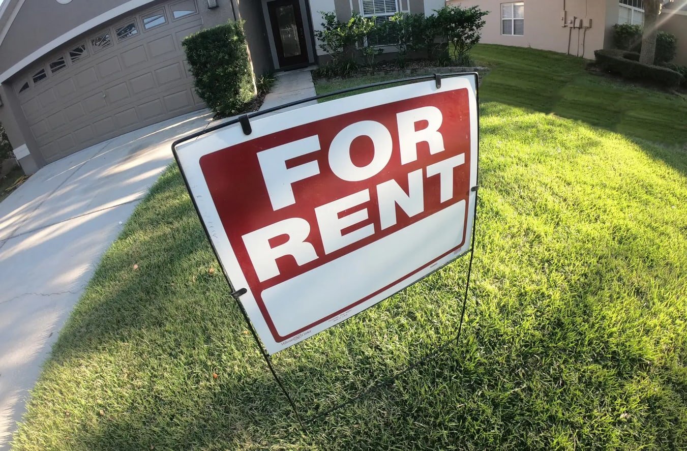 A Florida residential property with a "For Rent" sign in the yard, representing comprehensive insurance solutions for real estate investors.